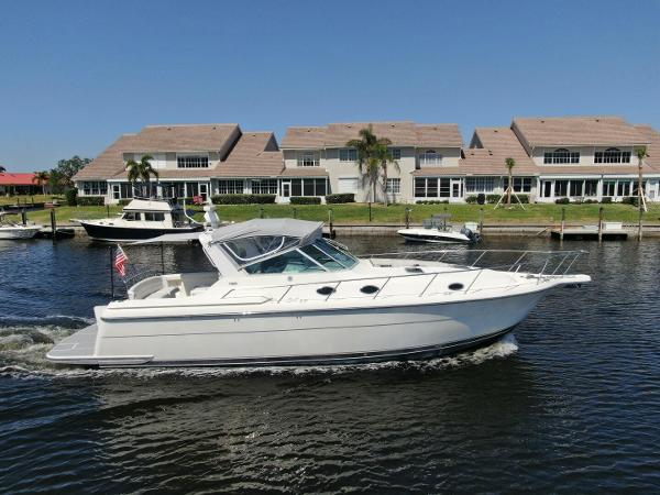 Tiara Yachts 4000 Express 1995 Tiara Yachts 4000 Express cruising on a calm waterway.