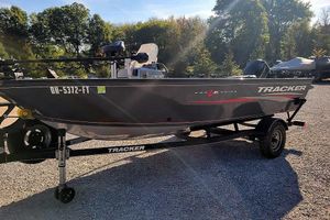 Tracker Pro Guide V-16 SC 2018 Tracker Pro Guide V-16 SC boat on trailer, parked outdoors.