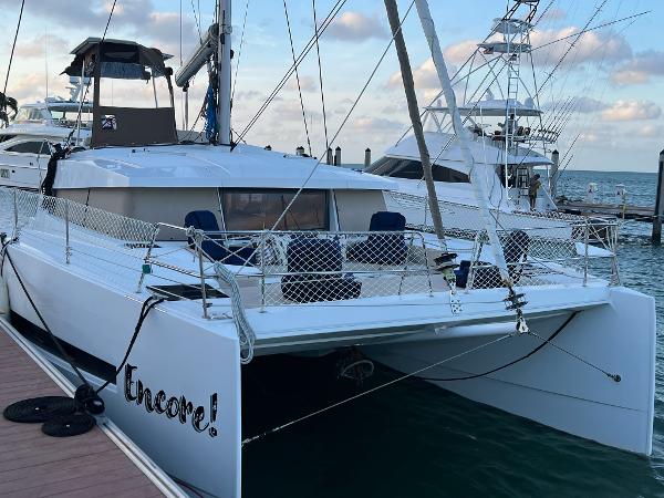 Bali 4.1 2020 Bali 4.1 catamaran docked at marina, featuring spacious deck and modern design.
