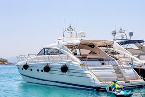 Princess V65 Luxury 2003 Princess V65 yacht docked in clear blue waters.