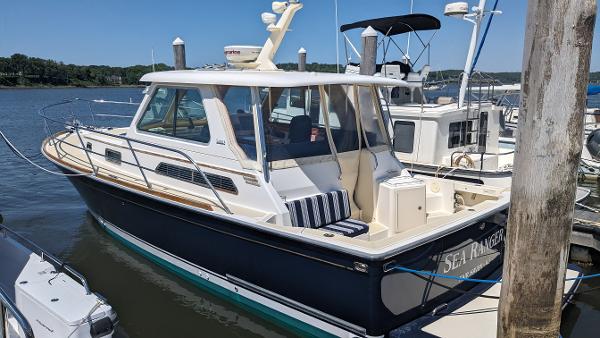 Sabre 34 Express 2008 Sabre 34 Express boat docked at marina on a sunny day.