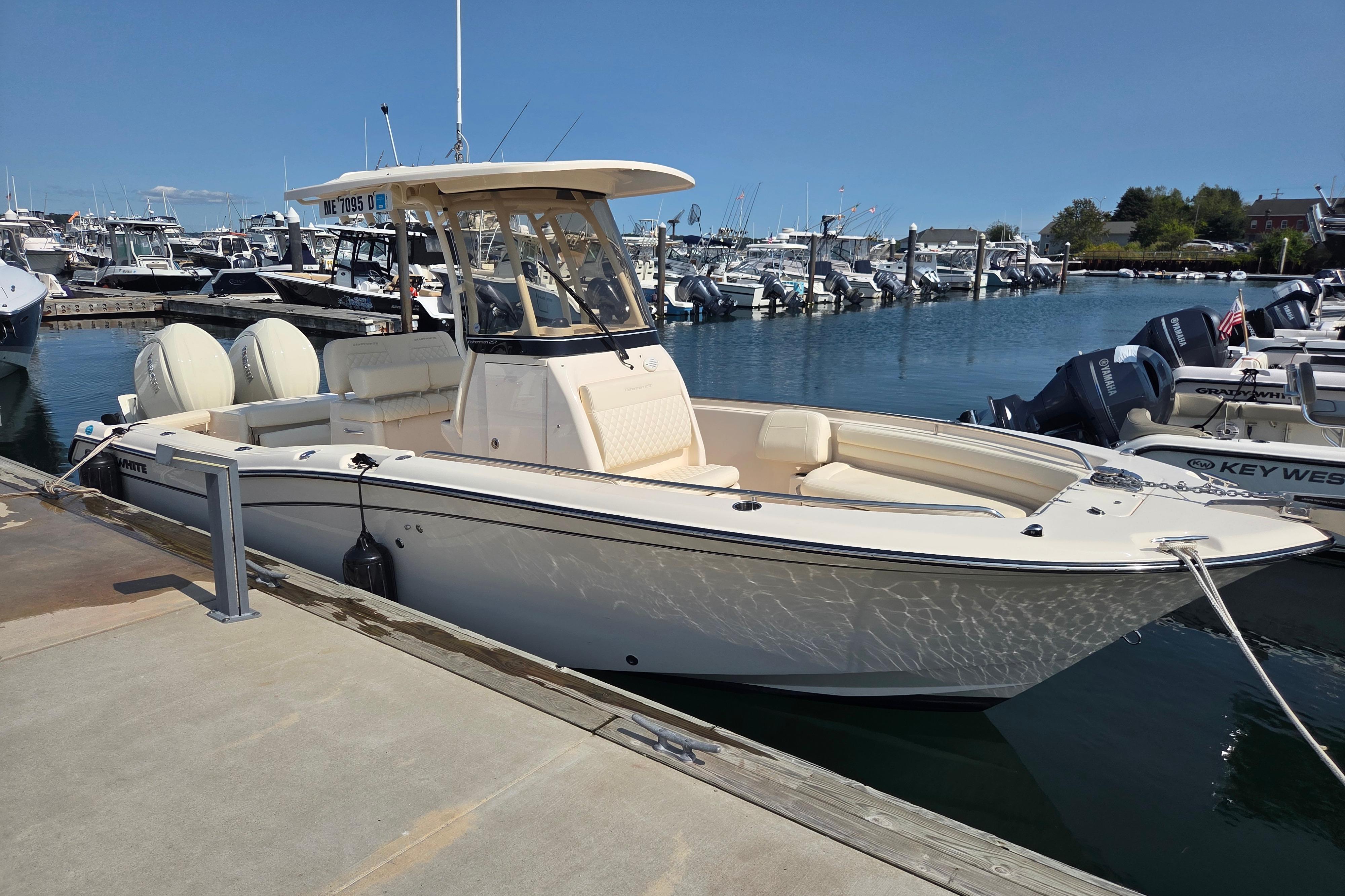 Grady-White Fisherman 257 2025 Grady-White Fisherman 257 boat docked at marina under clear blue sky.