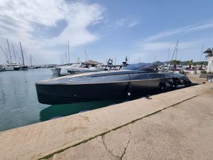 Frauscher 1414 Demon 2022 Frauscher 1414 Demon yacht docked at a marina, surrounded by other boats.