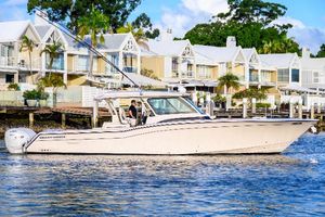 Grady-White Canyon 456 2024 Grady-White Canyon 456 boat cruising near waterfront homes.