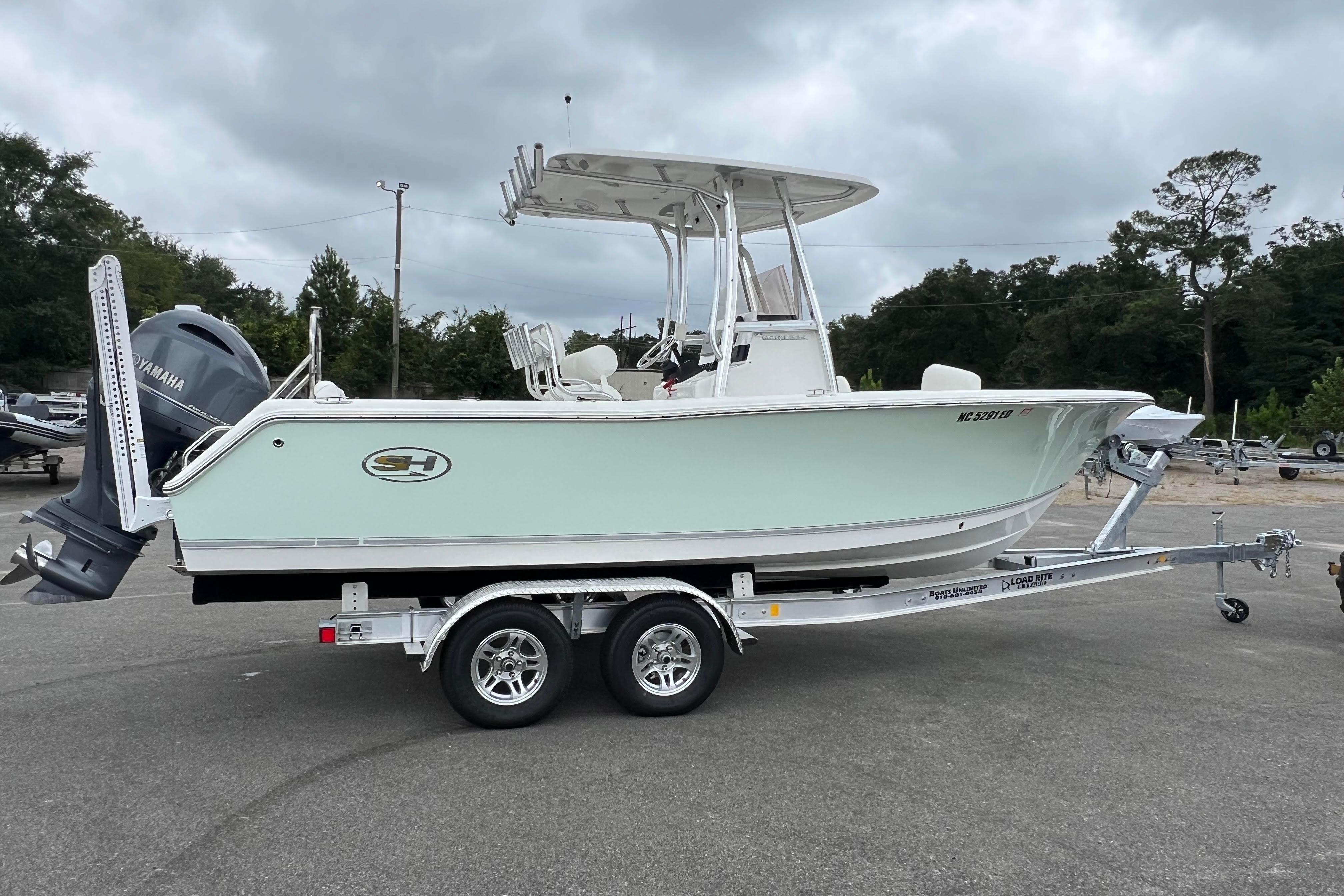 Sea Hunt Ultra 225 2016 Sea Hunt Ultra 225 boat on trailer with Yamaha engine, parked outdoors.