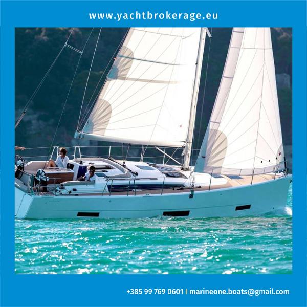 Dufour 390 2023 Dufour 390 sailboat cruising on turquoise waters.