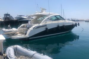 Sea Ray 310 Amberjack 2009 Sea Ray 310 Amberjack yacht docked in a marina, surrounded by calm water.