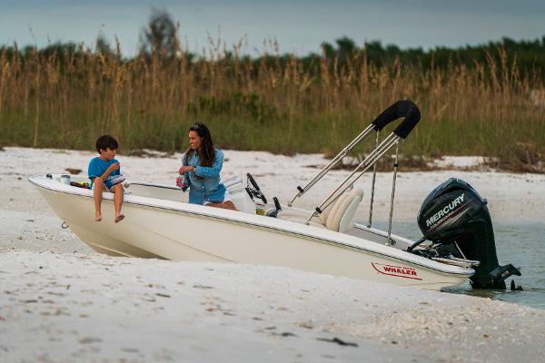 Boston Whaler 130 Super Sport Manufacturer Provided Image: 2025 Boston Whaler 130 Super Sport on sandy beach with two people.