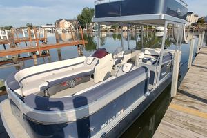 Tahoe Pontoon Cascade Funship 2023 Tahoe Pontoon Cascade Funship docked, featuring spacious seating and sleek design.