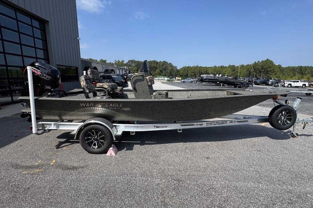 War Eagle Blackhawk 961 2026 War Eagle Blackhawk 961 boat on trailer, parked outdoors under clear sky.