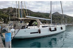 Dufour Exclusive 56 2017 Dufour Exclusive 56 yacht docked in a scenic marina.