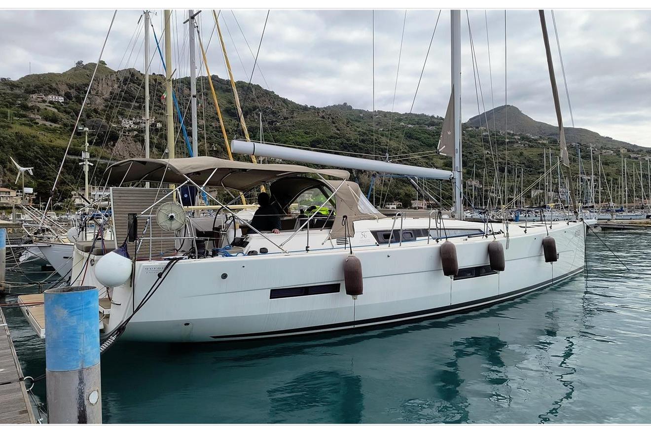 Dufour Exclusive 56 2017 Dufour Exclusive 56 yacht docked in a scenic marina.