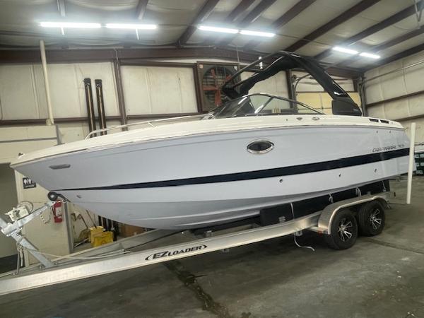 Chaparral 267 SSX 2025 Chaparral 267 SSX boat on trailer in indoor storage facility.