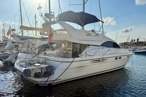 Fairline Phantom 46 2004 Fairline Phantom 46 yacht docked in a sunny marina.