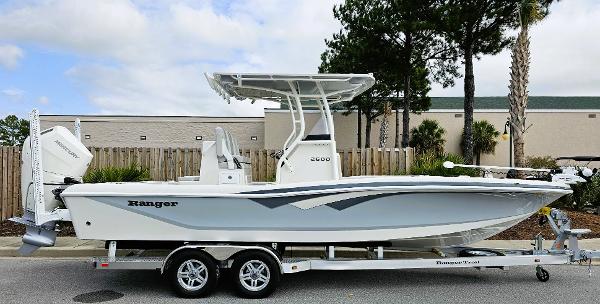 Ranger 2600 Bay 2024 Ranger 2600 Bay boat on trailer, side view, white hull, outdoor setting.