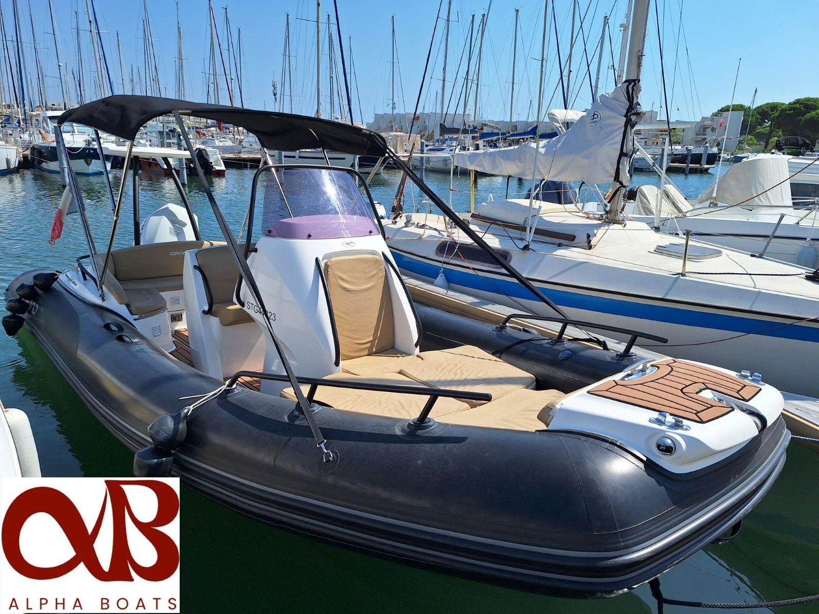 Grand Golden Line G650 2021 Grand Golden Line G650 boat docked at marina, featuring sleek design and comfortable seating.