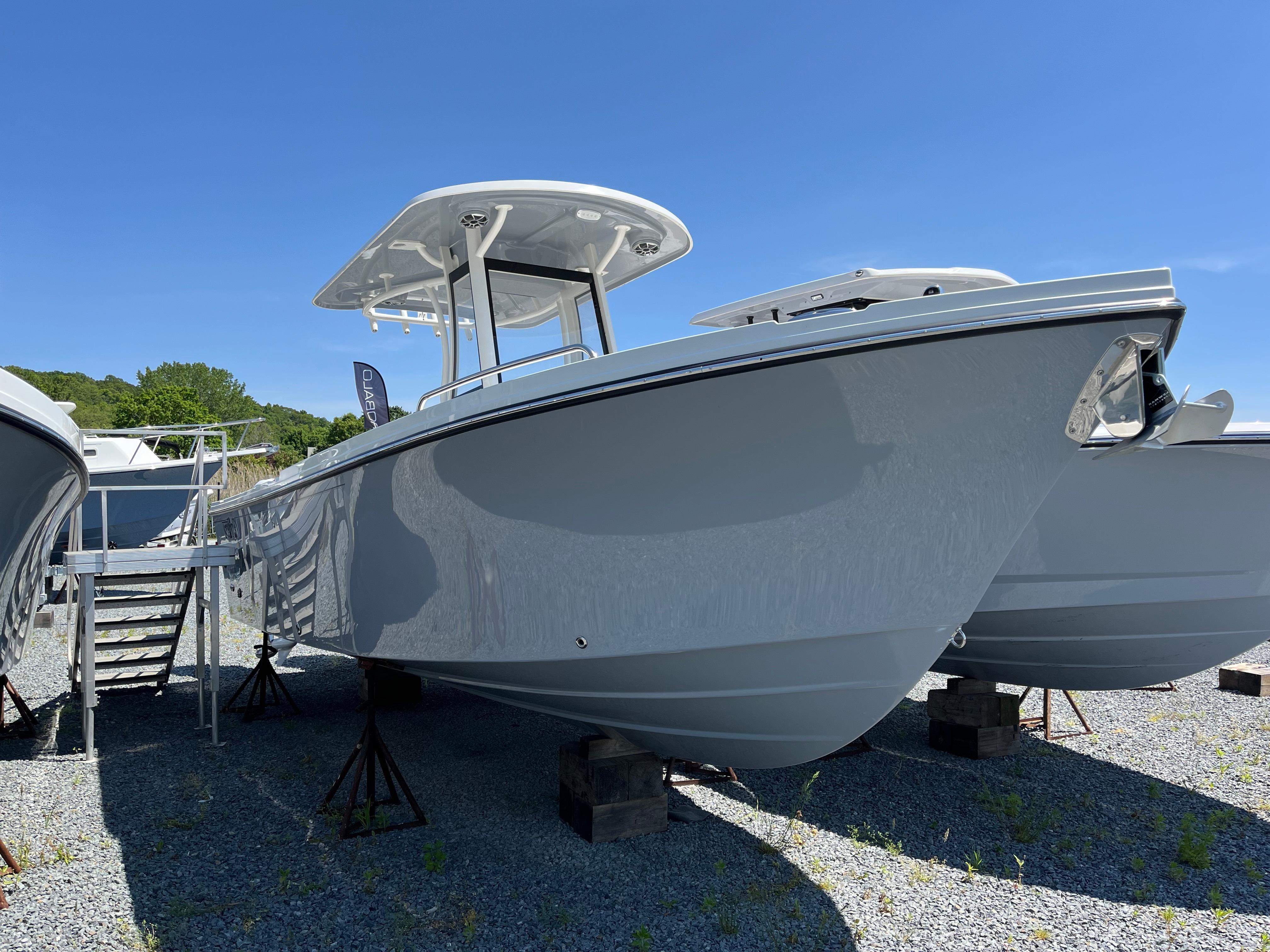Parker 2600 Center Console 2024 Parker 2600 Center Console boat displayed outdoors on a sunny day.