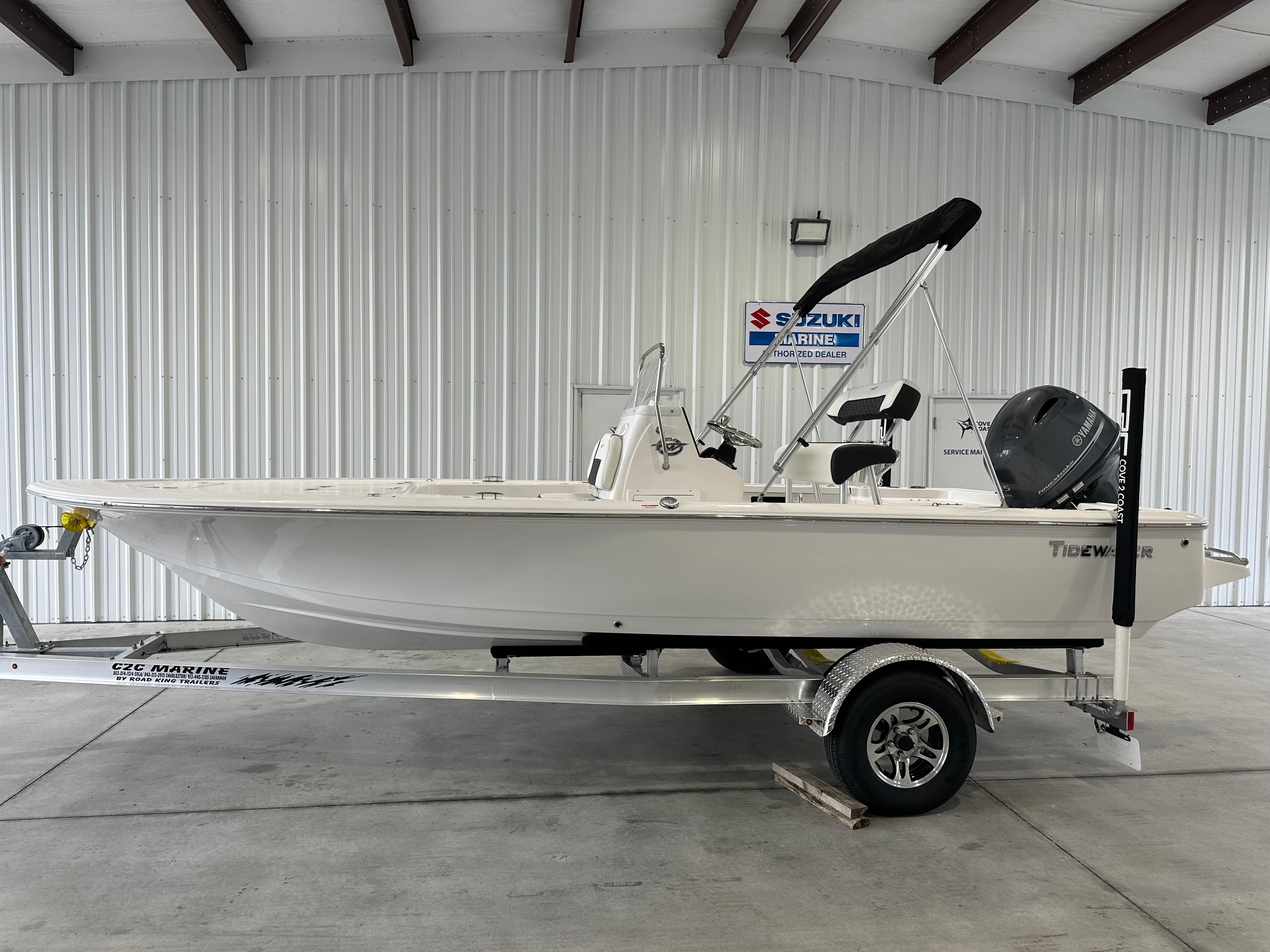Tidewater 1910 Bay Max 2026 Tidewater 1910 Bay Max boat on trailer in indoor showroom.