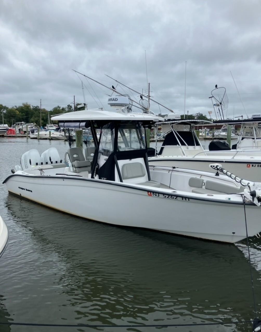 Cape Horn 27 XS 2023 Cape Horn 27 XS boat docked in a marina under cloudy skies.