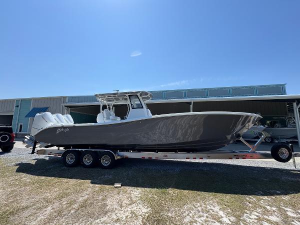 Yellowfin 36 Offshore 2025 Yellowfin 36 Offshore boat on trailer under clear blue sky.