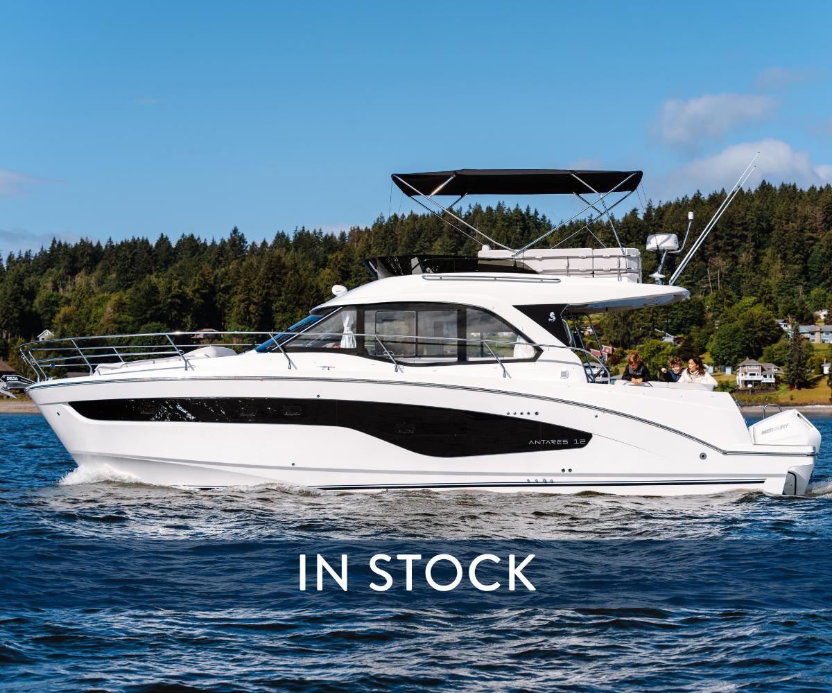 Beneteau Antares 12 2026 Beneteau Antares 12 yacht cruising on a scenic lake, available in stock.