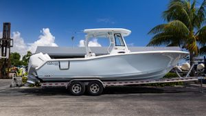 Tidewater 282 CC Adventure 2026 Tidewater 282CC Adventure boat on trailer, parked outdoors under a clear blue sky.