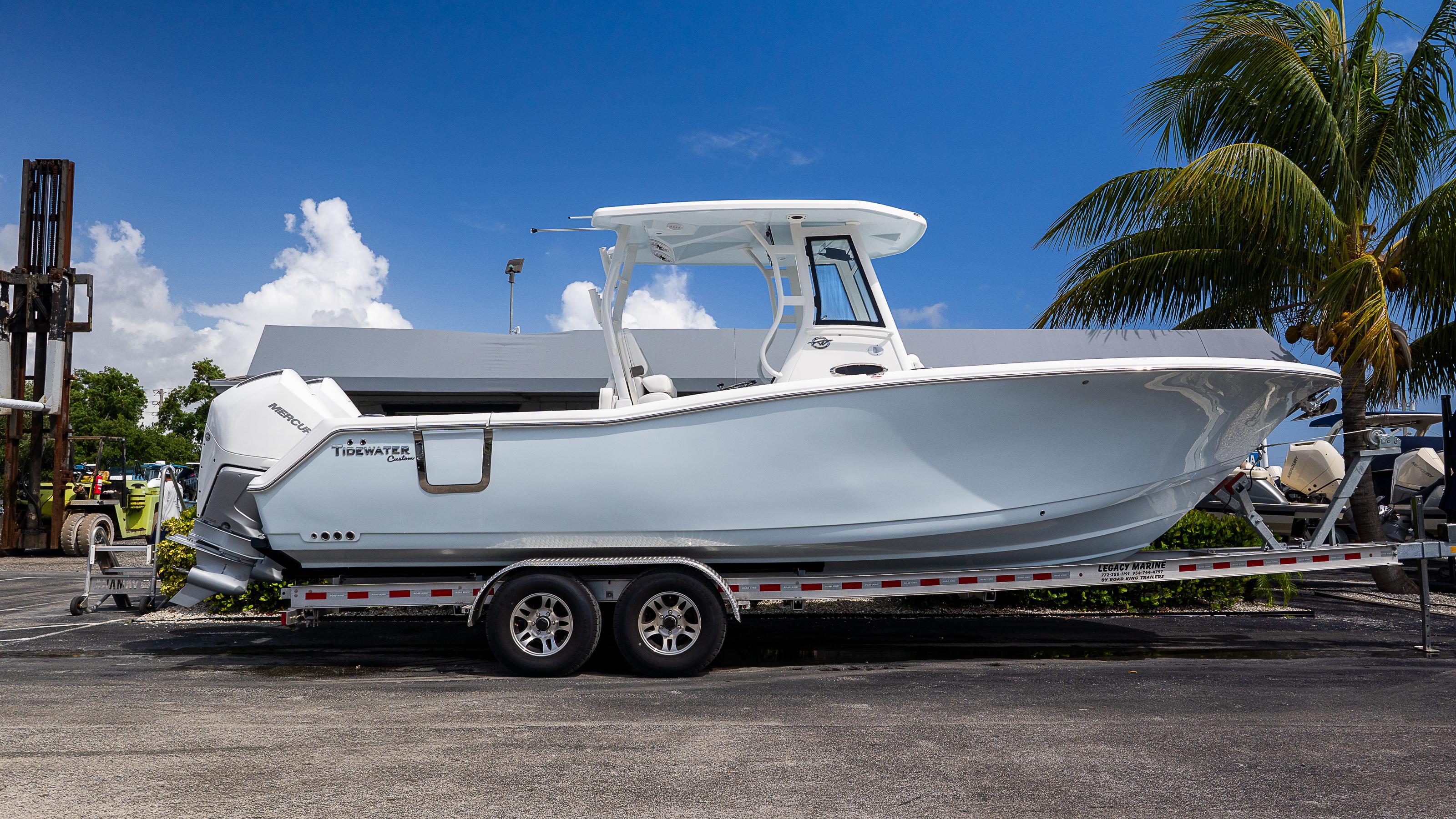 Tidewater 282CC Adventure 2026 Tidewater 282CC Adventure boat on trailer, parked outdoors under a clear blue sky.