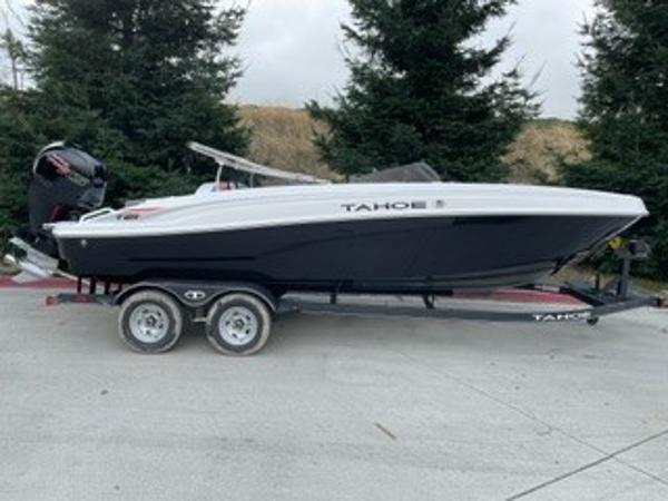 Tahoe T21 2024 Tahoe T21 boat on trailer, black and white, parked outdoors.