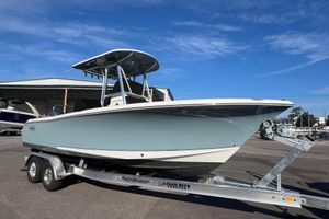 Sea Hunt Ultra 234 2021 Sea Hunt Ultra 234 boat on trailer under clear blue sky.