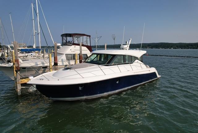 Tiara Yachts C39 Coupe 2022 Tiara Yachts C39 Coupe docked in a marina, calm waters, clear sky.