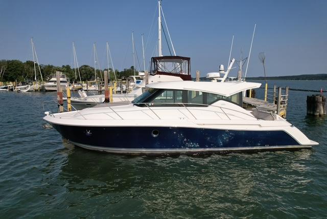 Tiara Yachts C39 Coupe 2022 Tiara Yachts C39 Coupe docked in a marina, side view.