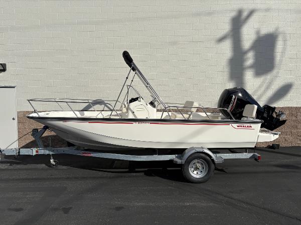Boston Whaler 170 Montauk 2025 Boston Whaler 170 Montauk boat on trailer, parked against a white wall.