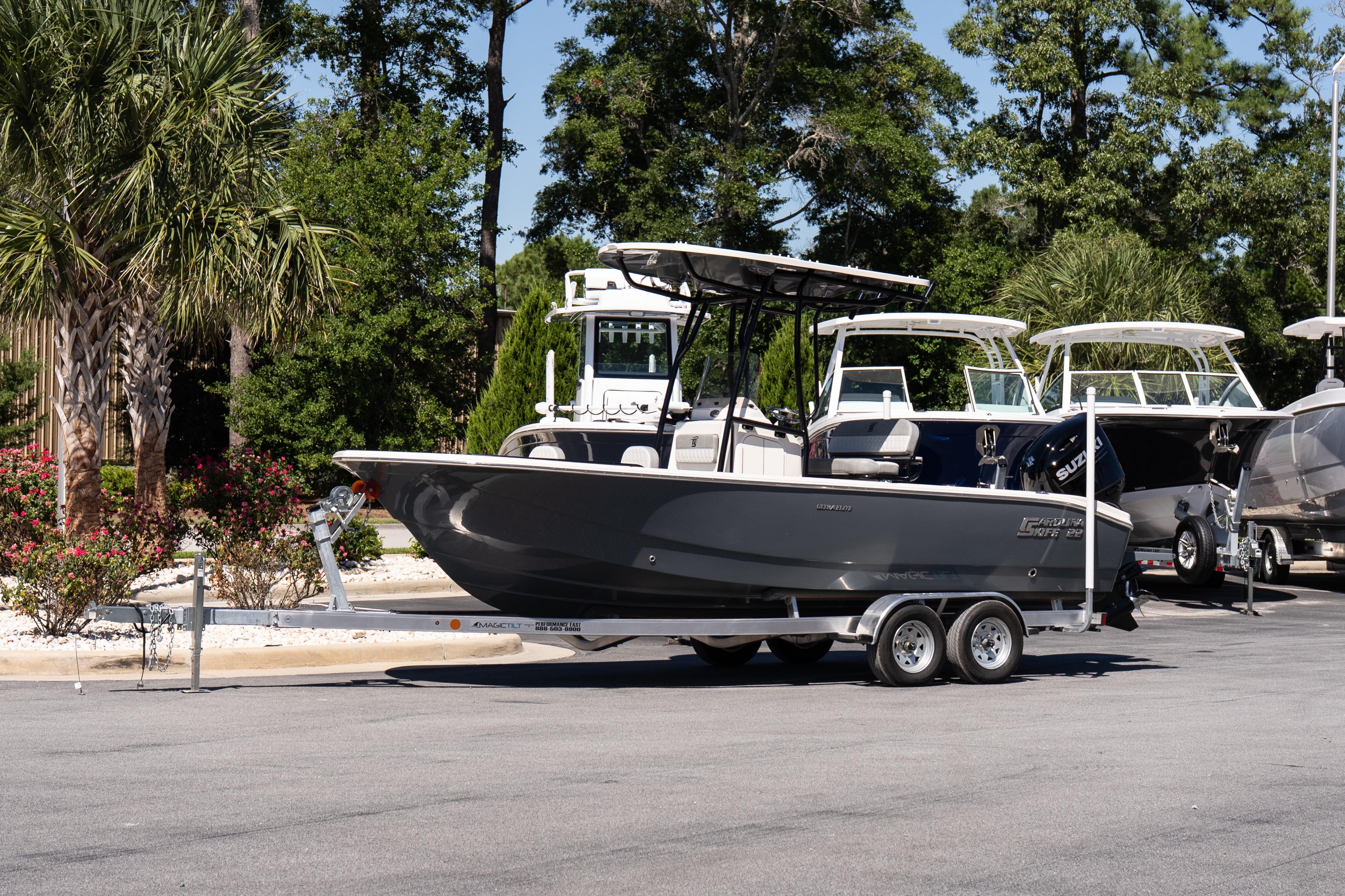 Carolina Skiff 22 Ultra Elite 2026 Carolina Skiff 22 Ultra Elite boat on trailer, parked outdoors.