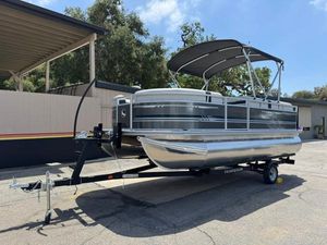 South Bay 18CR SE S Cruise 2025 South Bay 18CR SE S Cruise pontoon boat on trailer, parked outdoors.
