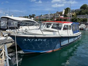 Lochin Fast Fisher 1996 Lochin Fast Fisher boat named Antaeus docked in a marina under a clear blue sky.