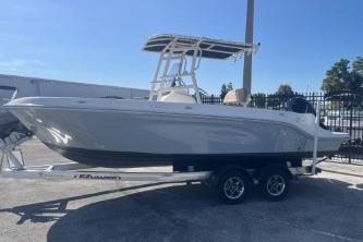 Trophy T22 2022 Trophy T22 boat on trailer, parked outdoors under clear sky.