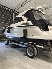 Regal 35 Sport Coupe 2013 Regal 35 Sport Coupe boat on trailer in garage.