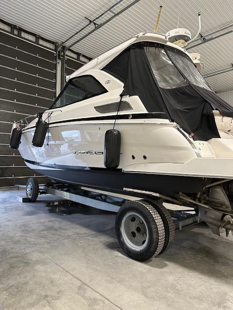 Regal 35 Sport Coupe 2013 Regal 35 Sport Coupe boat on trailer in garage.