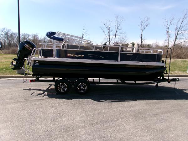 Ranger Reata 200F 2024 Ranger Reata 200F pontoon boat on trailer, parked outdoors.