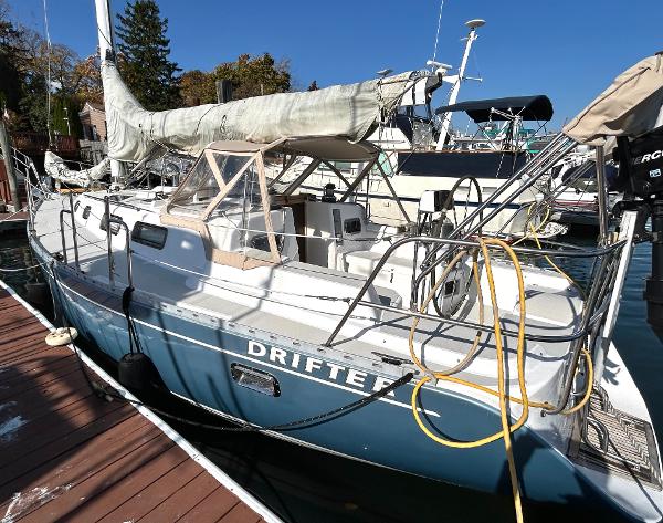 Freedom 35 Sailboat "Drifter" docked, Freedom 35 model, 1996, with blue hull and white deck.