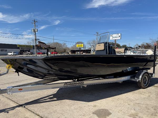SeaArk Bay Runner 210 2025 SeaArk Bay Runner 210 boat on trailer, parked outdoors under clear sky.