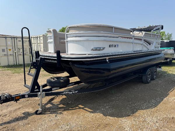 Ranger Reata 223C 2020 Ranger Reata 223C pontoon boat on trailer, parked outdoors.