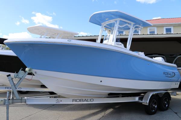 Robalo R230 Center Console 2024 Robalo R230 Center Console boat on trailer, blue hull, outdoor display.
