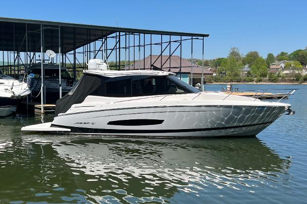 Regal 36 Grande Coupe 2021 Regal 36 Grande Coupe yacht docked on a sunny day.