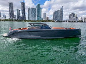 Vanquish VQ58 Luxury 2020 Vanquish VQ58 yacht cruising near city skyline.