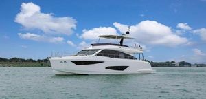 Custom 55 Custom 55 yacht cruising on a calm sea under a clear blue sky, 2023 model.