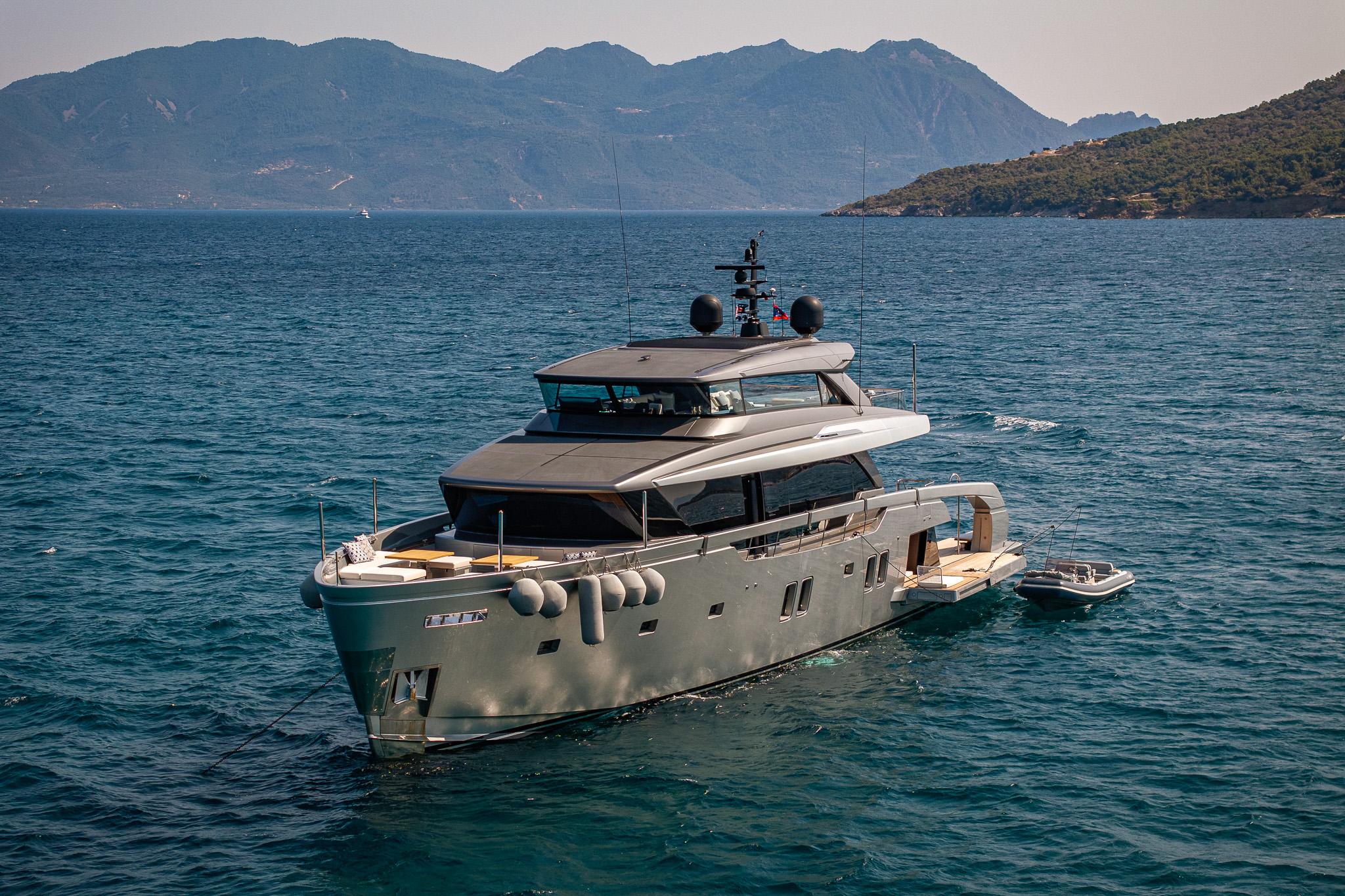 Sanlorenzo sx112 Sanlorenzo SX112 yacht cruising in scenic waters, 2021 model, with mountainous backdrop.