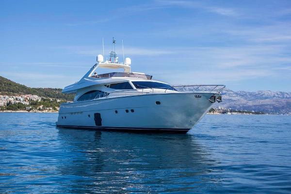 Ferretti Yachts 830 2006 Ferretti Yachts 830 cruising on calm blue waters with scenic coastal backdrop.