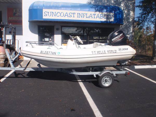 Mercury Amanzi 350 2014 Mercury Amanzi 350 inflatable boat on trailer outside Suncoast Inflatables store.