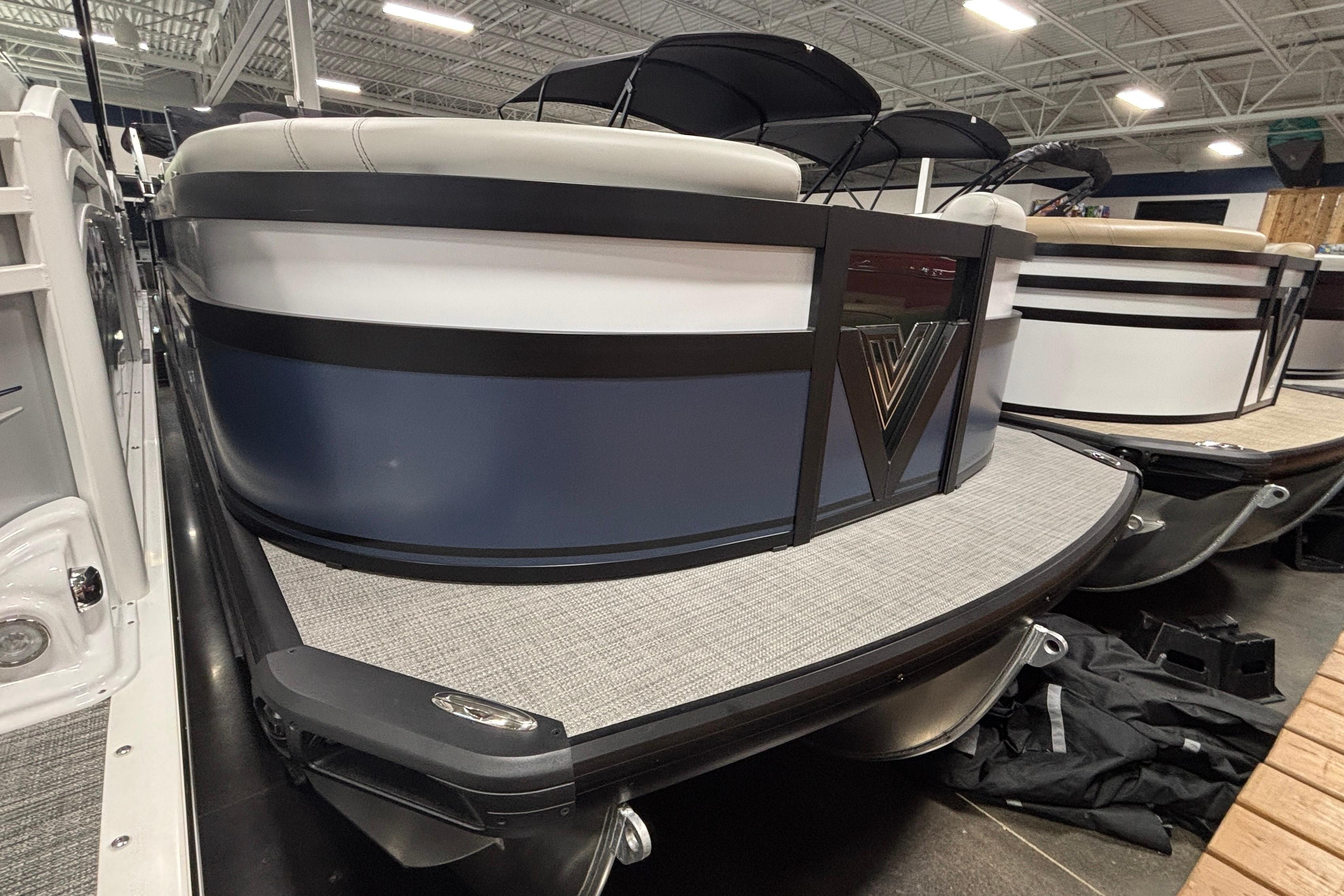 Viaggio D22U 2026 Viaggio D22U pontoon boat in showroom, featuring sleek design and modern finishes.